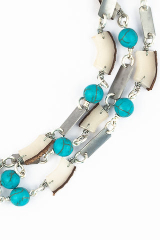 Rhino conservation snare & vegetable ivory necklace in blue